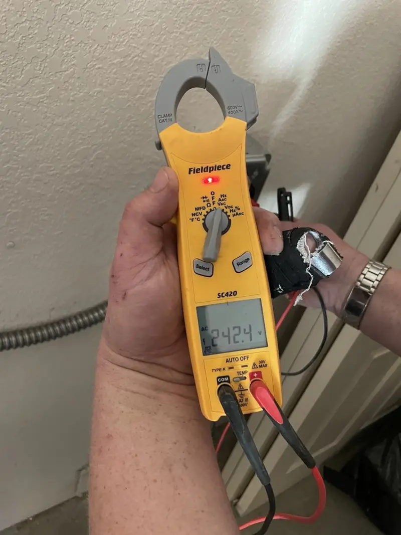 Voltage testing with clamp meter during Generator Installation in Haltom City